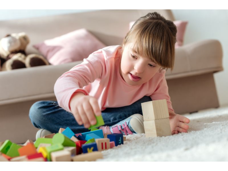 kid-with-down-syndrome-playing-with-toy-cubes-2022-02-01-22-36-57-utc.jpg